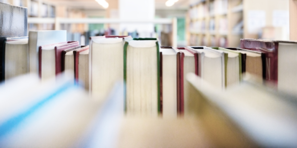 books on a shelf for Effective project management in publishing blog